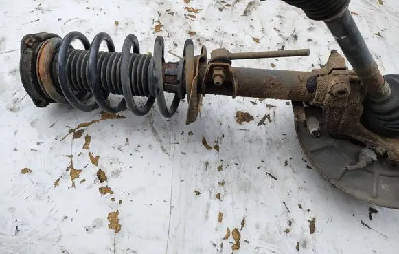 Volkswagen Caddy Front shock absorber with coil spring 
