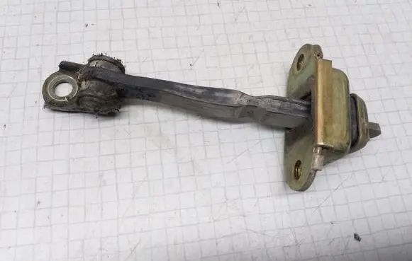 Nissan Primera Rear door check strap stopper