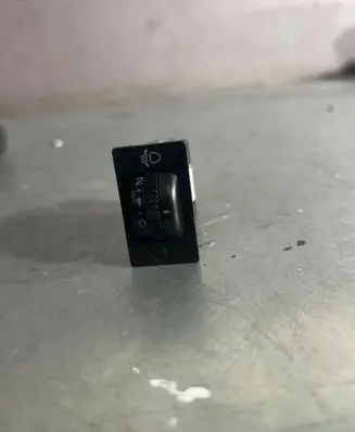 Headlight level height control switch