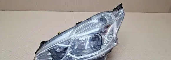 Peugeot 208 I Headlight/headlamp 9802221880