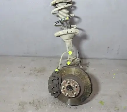 Subaru Outback Front shock absorber with coil spring