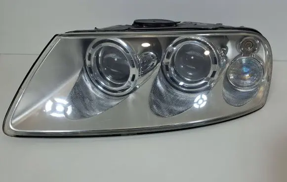 Volkswagen Touareg I Headlight/headlamp 7L6941015BB 89307851 1802A5394