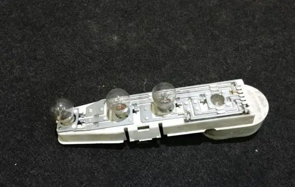 Tail light bulb cover holder