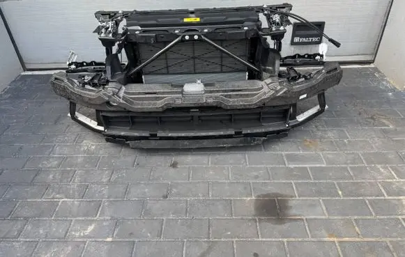 Radiator support slam panel