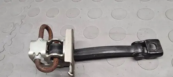 Front door check strap stopper