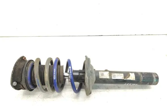 Volkswagen Golf VII Front shock absorber with coil spring 5Q0412037JL 5Q0413031FN