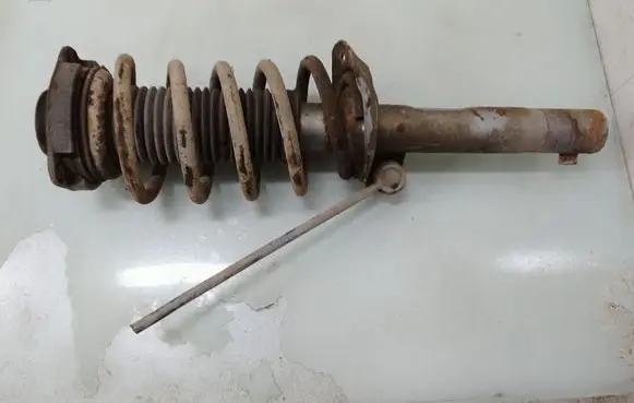 Volkswagen Caddy Front shock absorber with coil spring