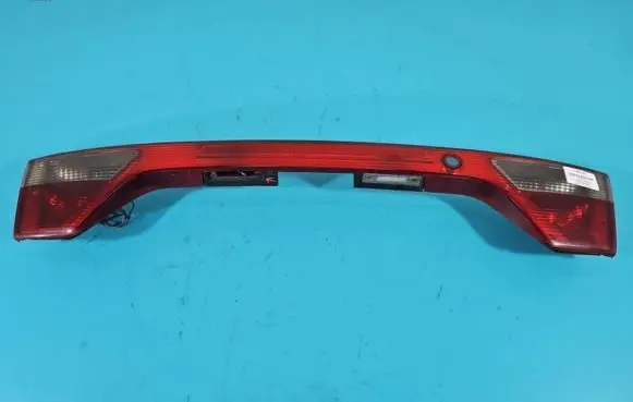 Trunk door license plate light bar