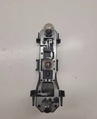 Tail light bulb cover holder