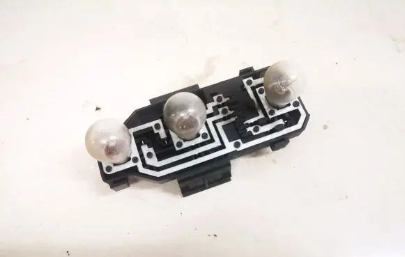 Tail light bulb cover holder