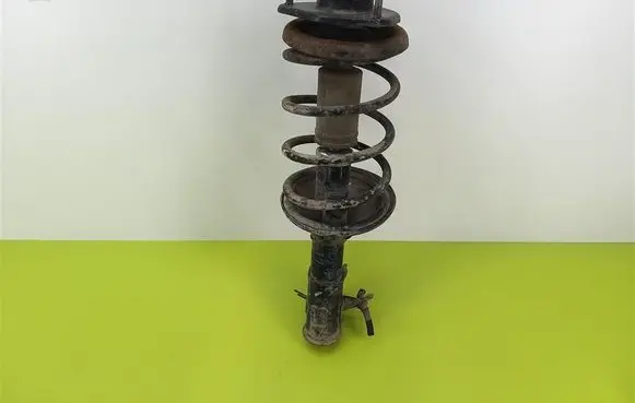 Mitsubishi Carisma Front shock absorber with coil spring