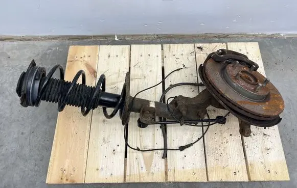 Nissan Juke I F15 Front shock absorber with coil spring 
