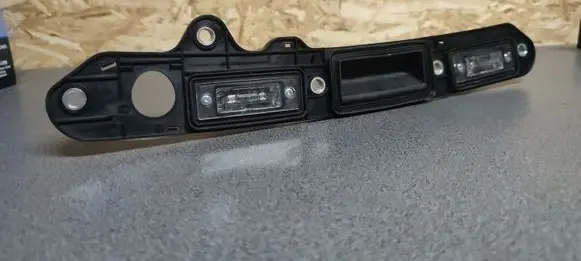 Volkswagen Golf V Trunk door license plate light bar 1T0827574A