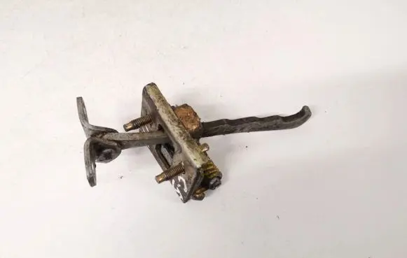 Front door check strap stopper