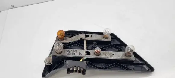 Tail light bulb cover holder
