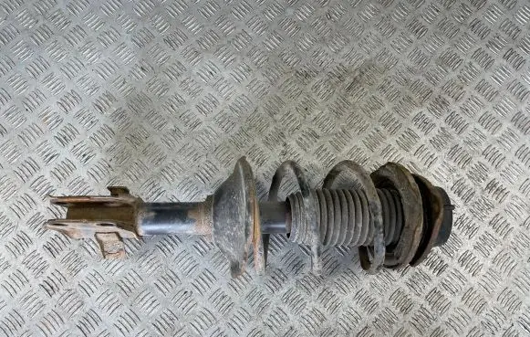 Subaru Impreza I Front shock absorber with coil spring