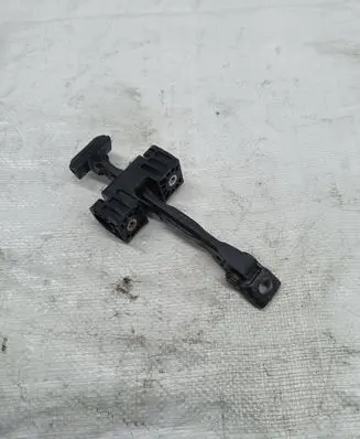 Front door check strap stopper