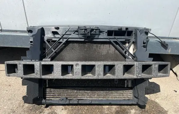 Radiator support slam panel
