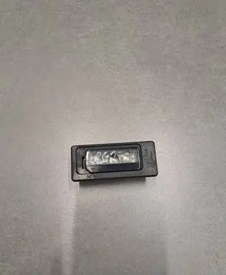 Volkswagen PASSAT B7 Number plate light 7TL82SAE 3Af943021A
