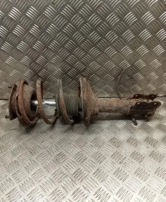 Nissan Maxima Front shock absorber with coil spring