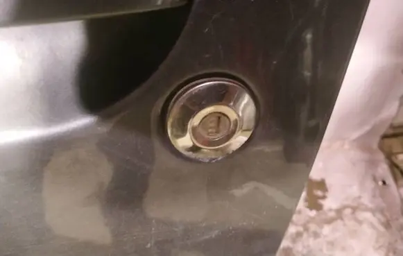 Mitsubishi Colt Front door lock (next to the handle) 