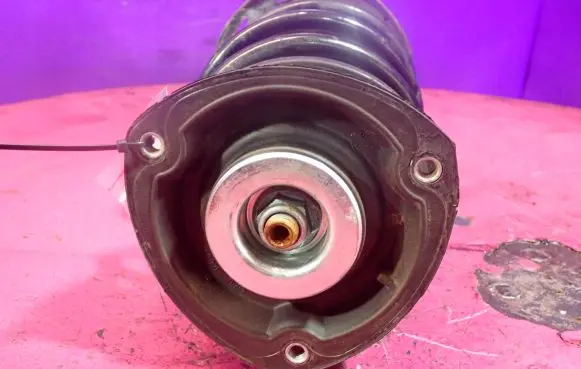 Front shock absorber with coil spring