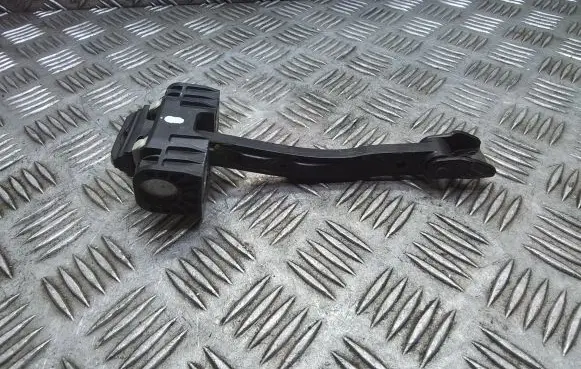 Front door check strap stopper