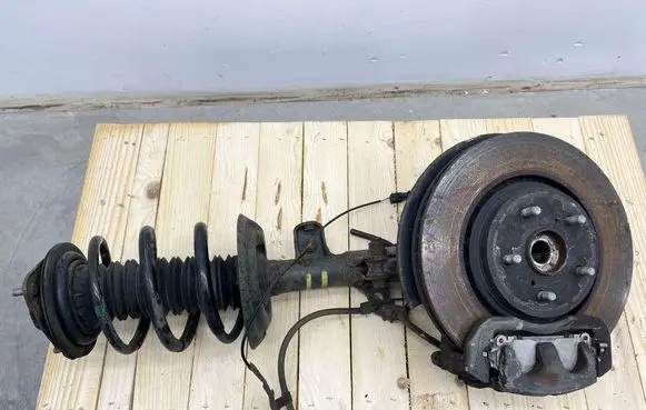 Front shock absorber with coil spring