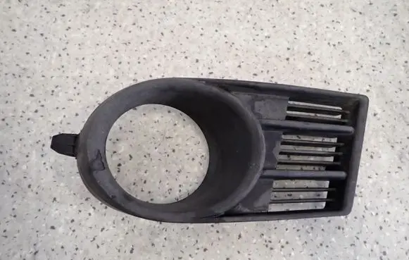 Suzuki Swift I Front fog light trim/grill 
