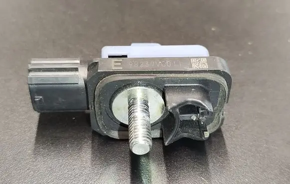 Front door check strap stopper