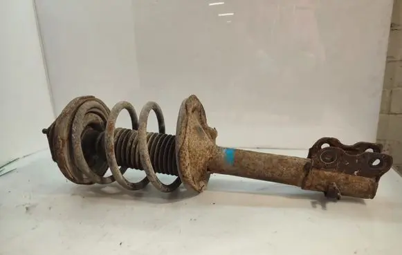 Nissan X-Trail T30 Front shock absorber with coil spring