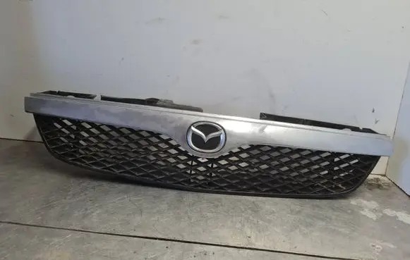 Mazda 323 F Front bumper upper radiator grill