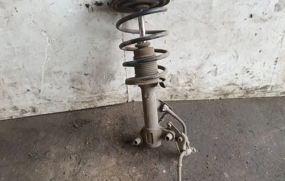 Nissan Primera Front shock absorber with coil spring
