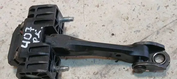 Front door check strap stopper