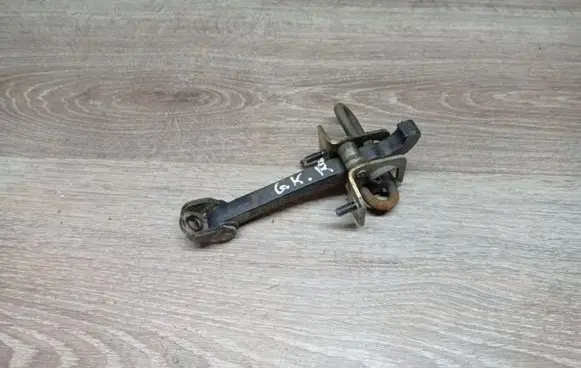 Rear door check strap stopper