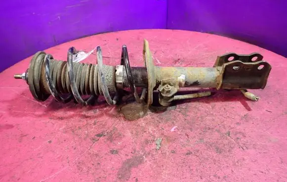 Toyota Yaris Front shock absorber with coil spring