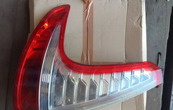 Tail light bulb cover holder