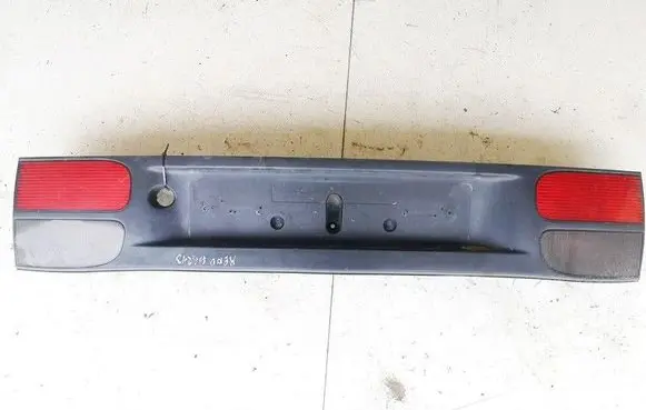 Trunk door license plate light bar