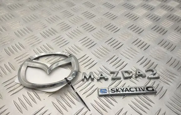 Mazda 2 Manufacturers badge/model letters K0415