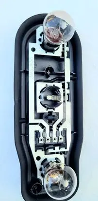 Tail light bulb cover holder