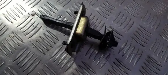 Mazda 323 F Rear door check strap stopper
