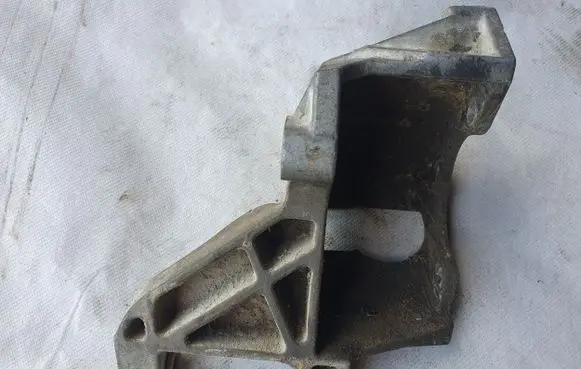 Volkswagen Golf III Power steering pump mounting bracket 028145523C