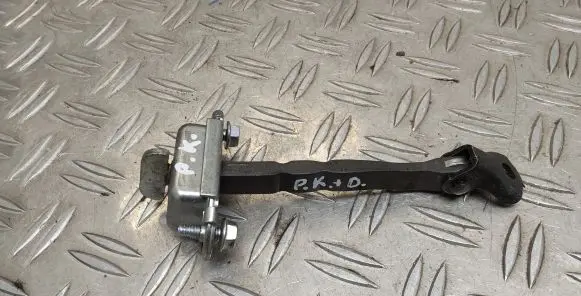 Front door check strap stopper