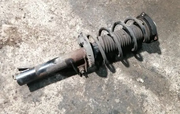 Volkswagen Golf Plus Front shock absorber with coil spring 1K0413031BE
