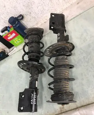 Opel Astra L Front shock absorber with coil spring 9846669680