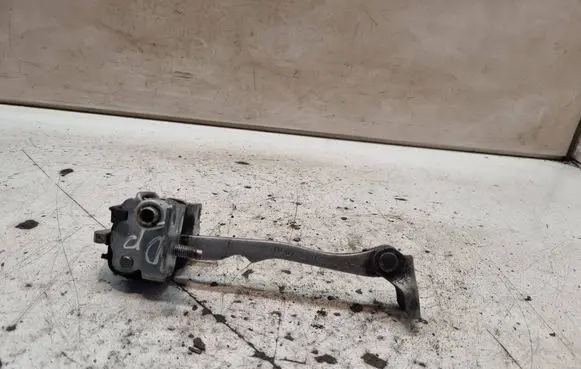 Front door check strap stopper
