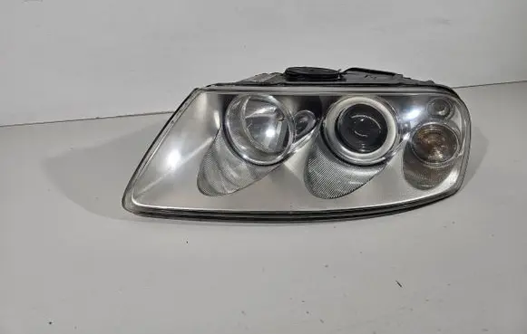 Volkswagen Touareg I Headlight/headlamp 120120261802