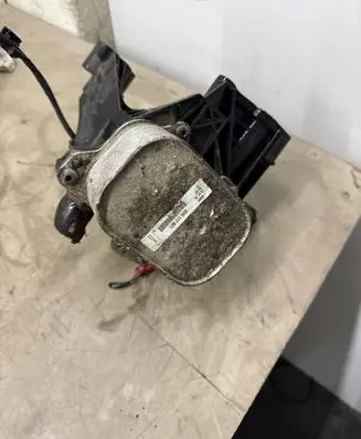Volkswagen PASSAT B8 Oil filter mounting bracket 03N117021