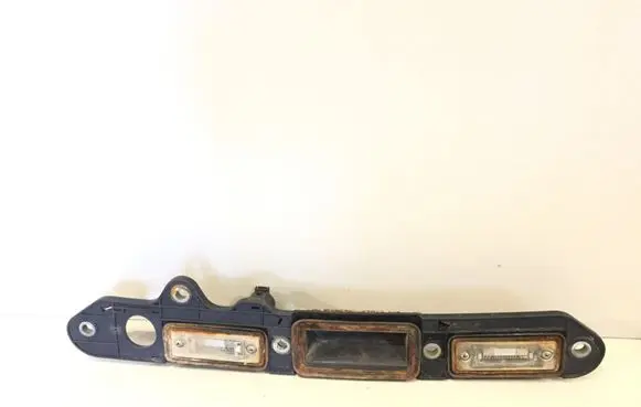 Volkswagen Touran I Trunk door license plate light bar 1T0827574C