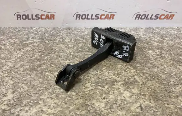 Front door check strap stopper